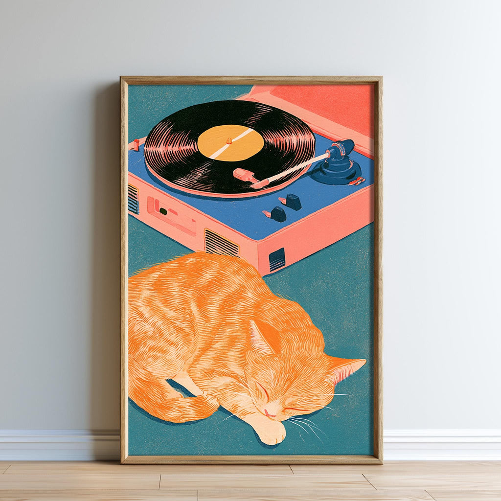 A framed illustration depicting an orange cat sleeping on a turquoise surface, with a record player and turquoise record album in the background.