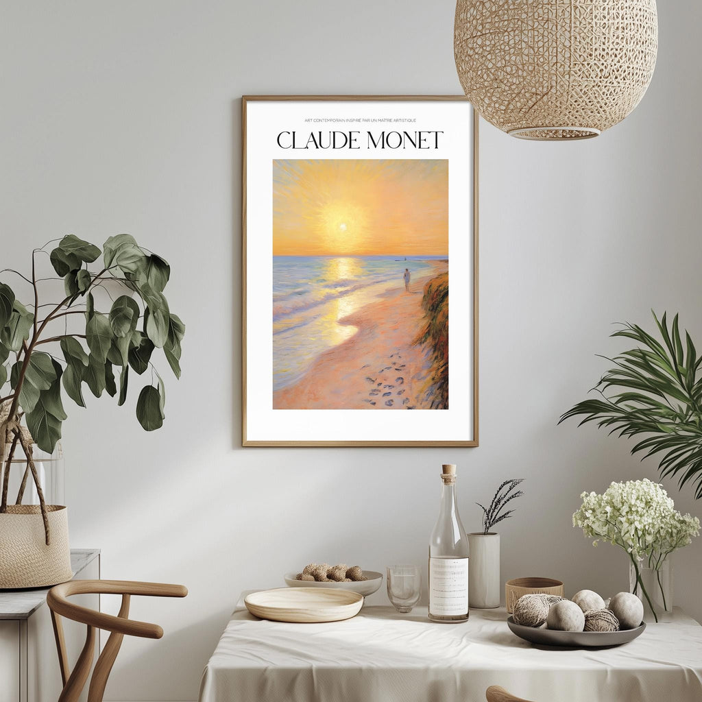 a framed painting of a beach scene with a sunset, hanging on a wall above a dining table with various decorative items and plants.