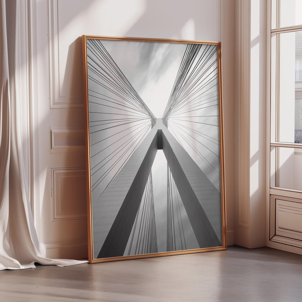 a large, framed photograph of a building with a striking architectural design, featuring a series of vertical lines that create a sense of depth and perspective.