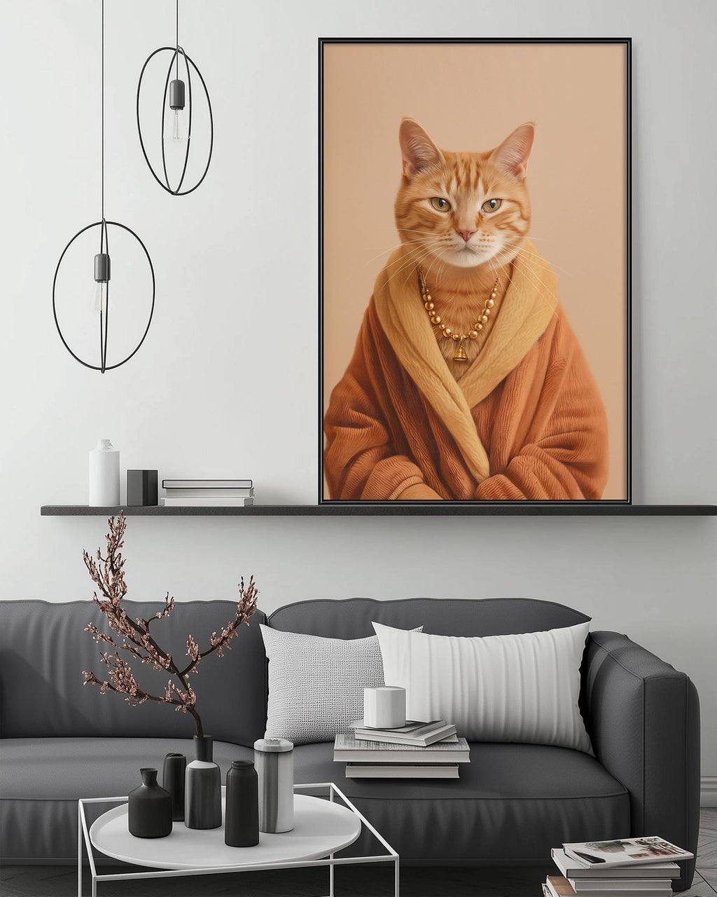 a large framed picture of a cat wearing a robe, displayed on a wall above a gray couch in a living room setting.