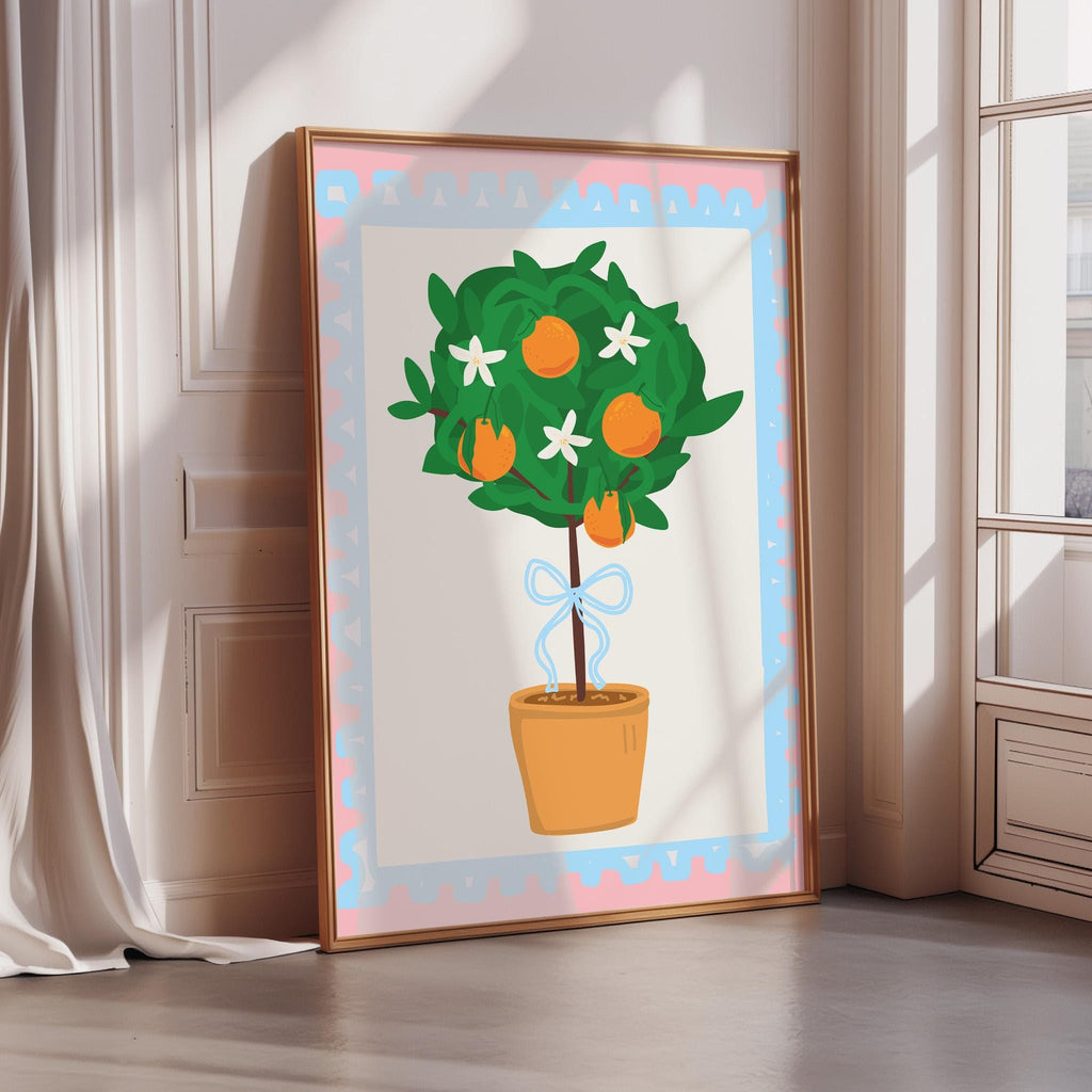 A framed illustration of a potted tree with orange fruits and white flowers is displayed on a wall.