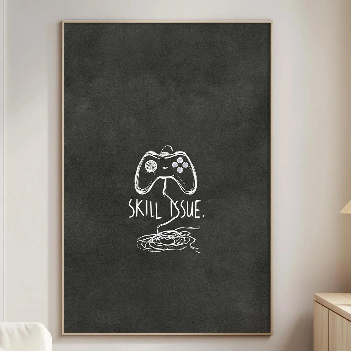 a living room with a white sofa, a wooden side table, and a framed artwork on the wall that says "Skill Issue."