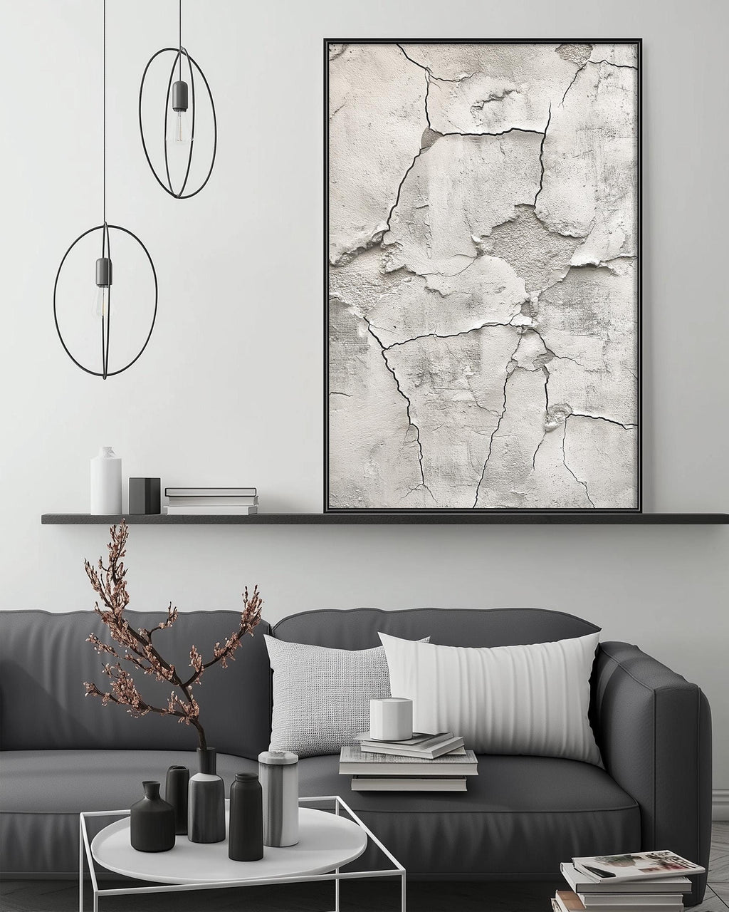 a modern living room with a gray sofa, a coffee table, and a large abstract painting on the wall.