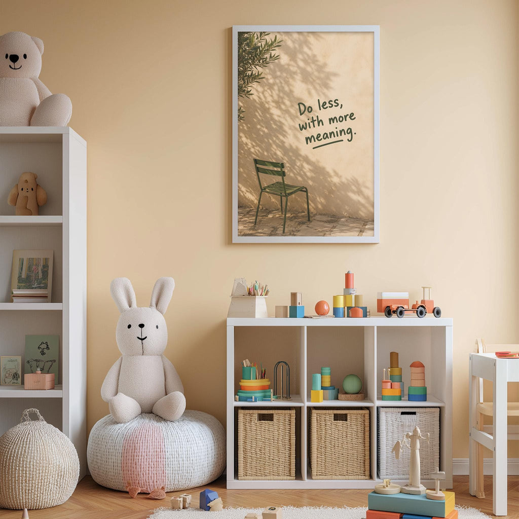 a child's bedroom with a white bookshelf, a stuffed rabbit, a toy train, and a framed poster with the text "Do less, with more meaning" on the wall.