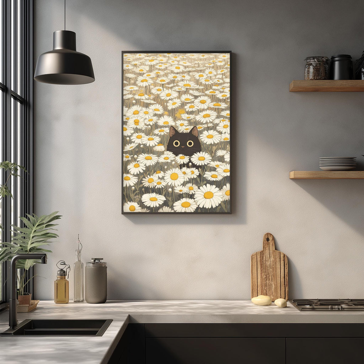 a kitchen counter with a framed picture of a cat peeking out from a field of daisies hanging on the wall above it.