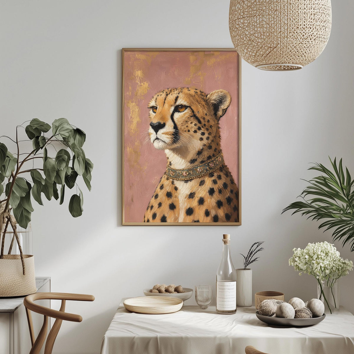 a cheetah portrait hanging on a wall, with a dining table and chairs in the foreground. The table is set with plates, bowls, and a bottle, creating a cozy dining atmosphere. The room is decorated with potted plants and a woven light fixture, adding a touch of nature and warmth to the space.