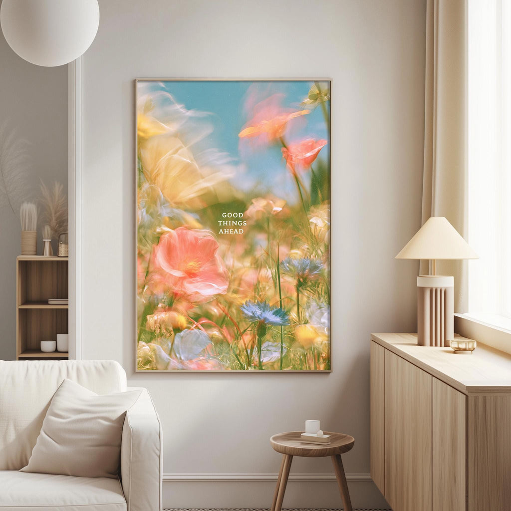 a large, colorful painting of flowers hanging on a wall in a living room.