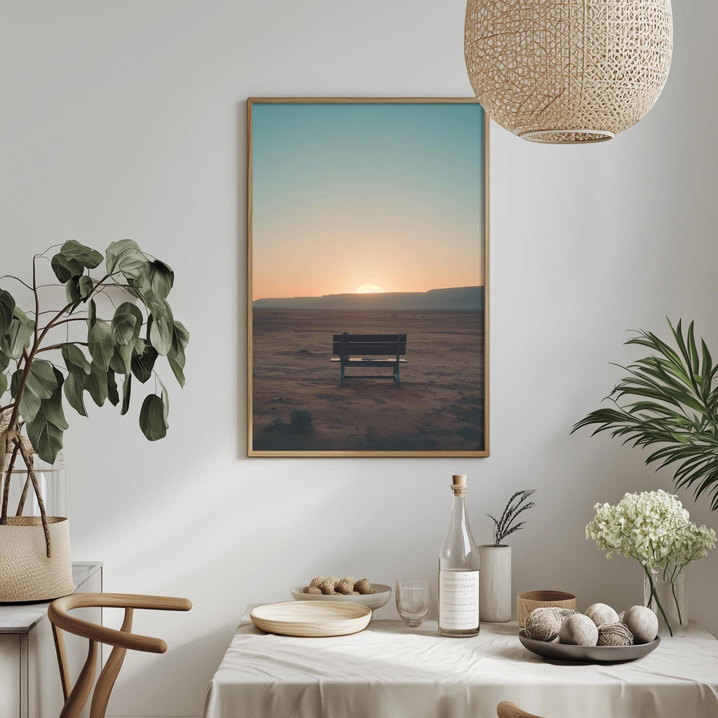 a serene scene of a bench in a desert landscape, with a warm sunset in the background. The bench is positioned in the middle of the frame, creating a focal point in the composition. The desert landscape extends to the horizon, adding depth and scale to the image. The warm colors of the sunset create a peaceful and tranquil atmosphere.