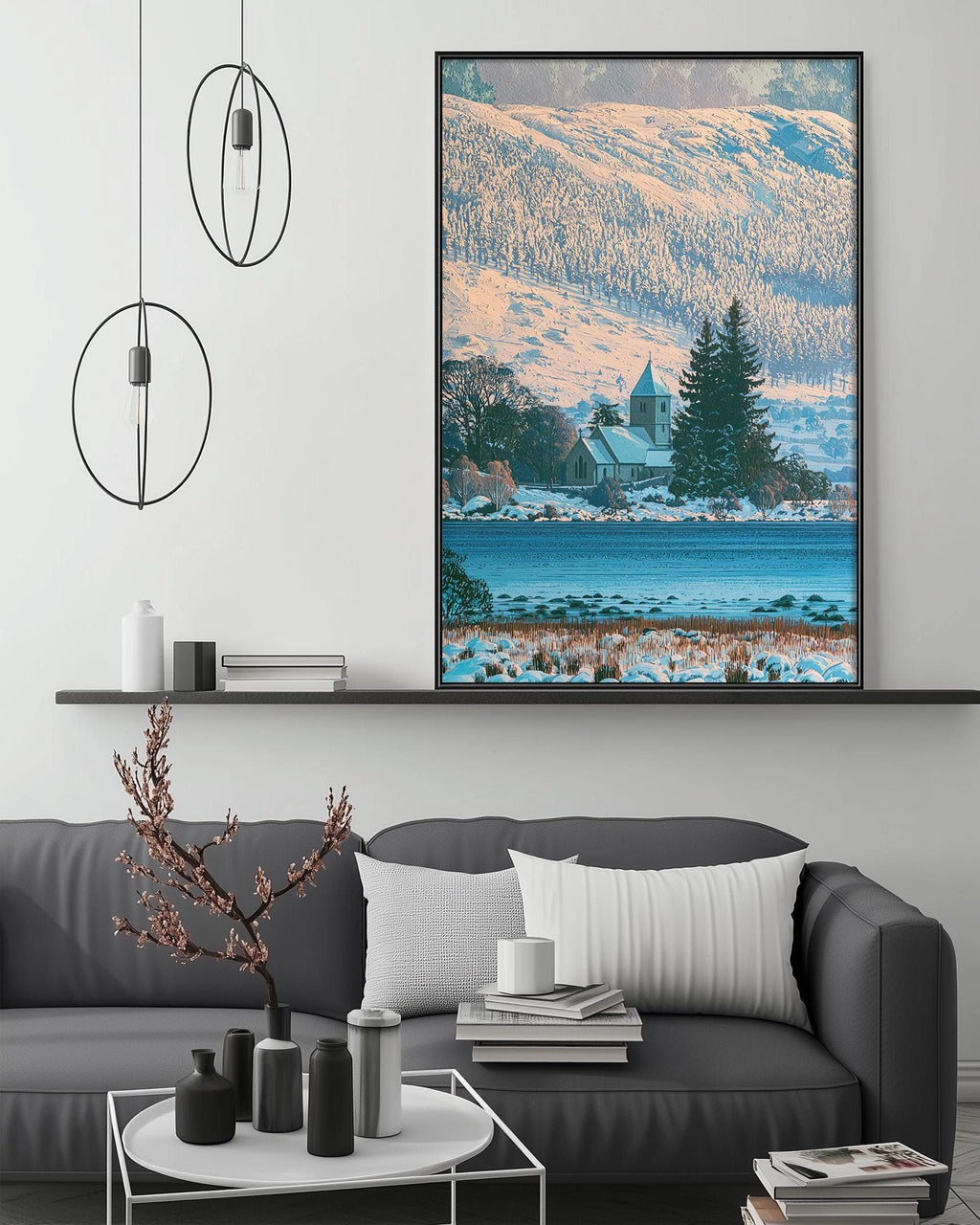 a cozy living room with a gray sofa, a coffee table, and a large framed picture of a snowy mountain landscape hanging on the wall above the sofa.