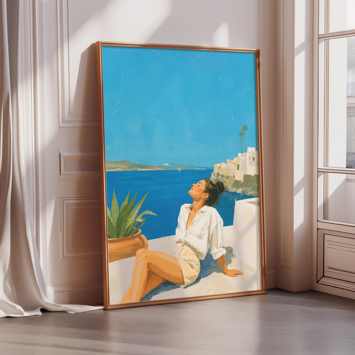A framed painting depicting a woman sitting on a balcony overlooking a scenic ocean view.