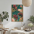 a dining table with a white tablecloth, a bowl of fruit, a bottle, and a vase with flowers. Above the table, there is a framed poster with the text "STAY WILD" in the center.