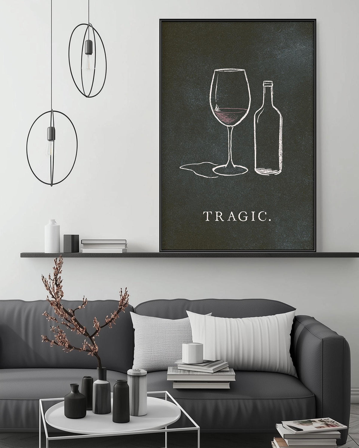a living room with a gray sofa, a coffee table, and a large framed artwork depicting wine glasses and a bottle on the wall.