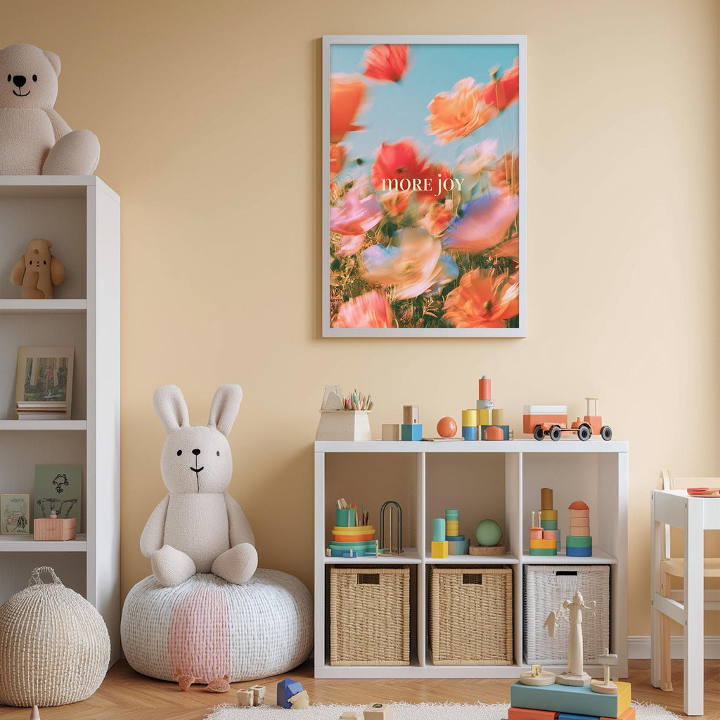 A cozy and colorful children's bedroom with a large stuffed bunny, a bookshelf, and a toy chest filled with toys. The walls are painted a light peach color, and there is a framed poster with a flowery design hanging above the bookshelf.