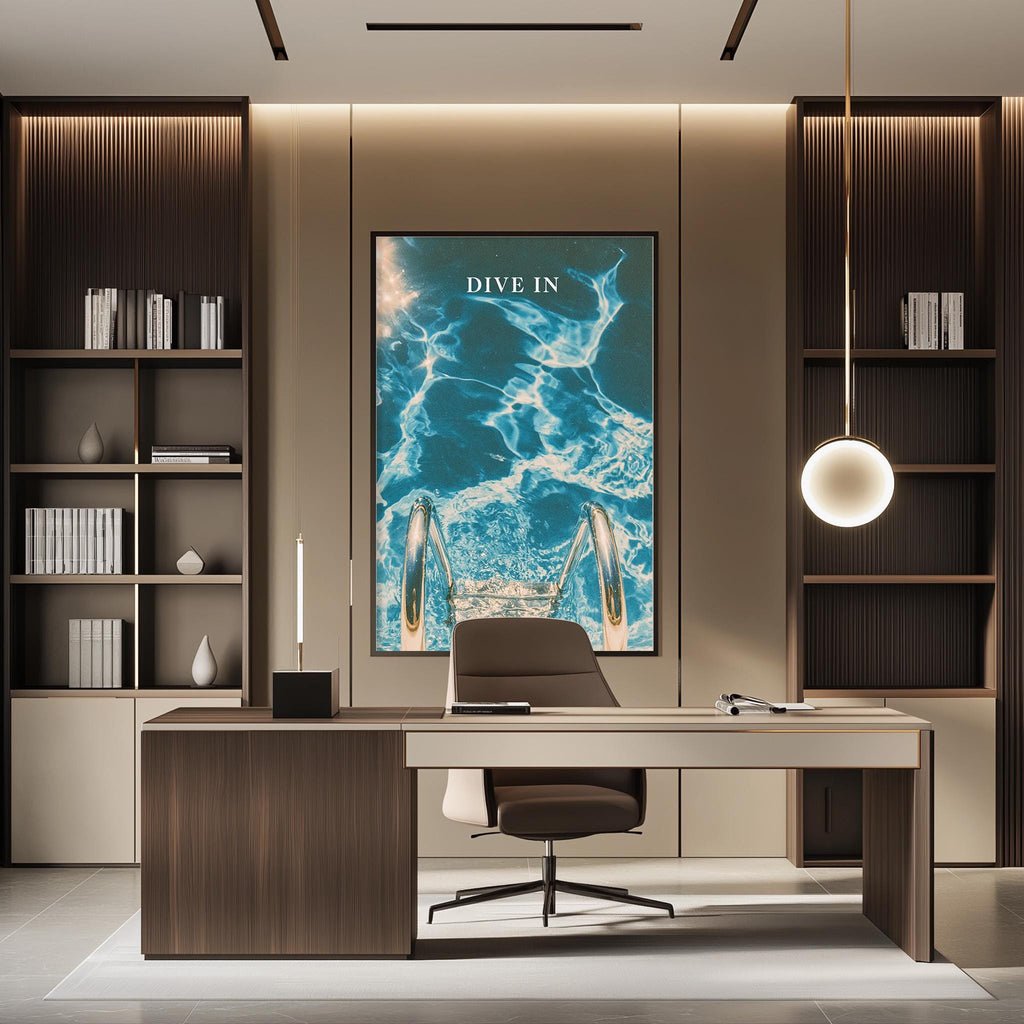 a modern and stylish office space with a large framed poster of a swimming pool on the wall, a wooden desk with a chair, and built-in bookshelves.