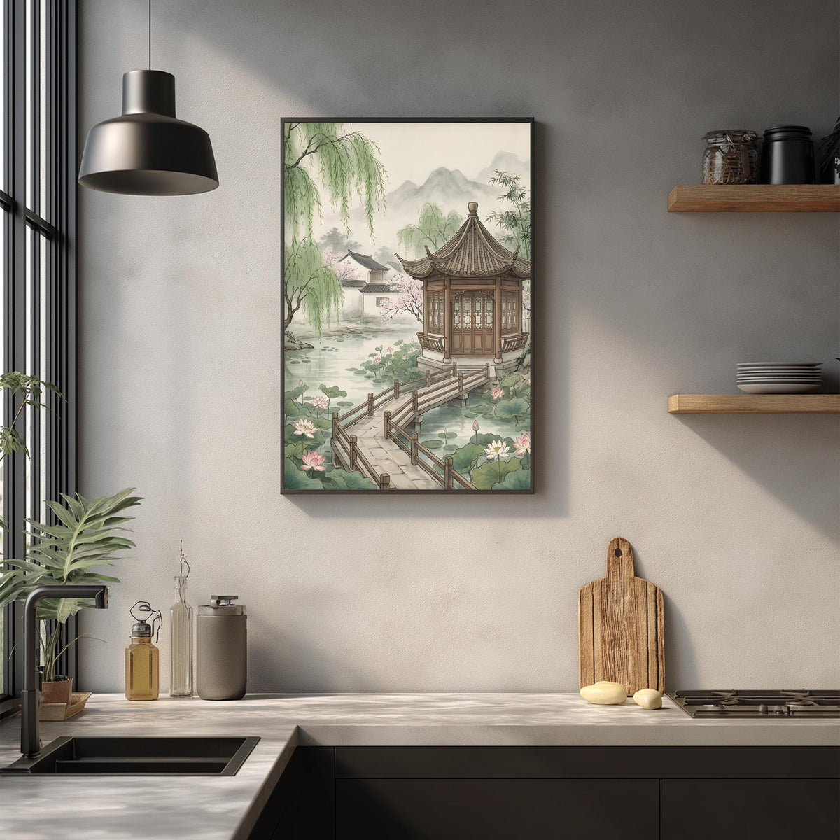 a kitchen with a framed painting of a traditional Chinese pavilion hanging on the wall above a wooden cutting board and other kitchen items.
