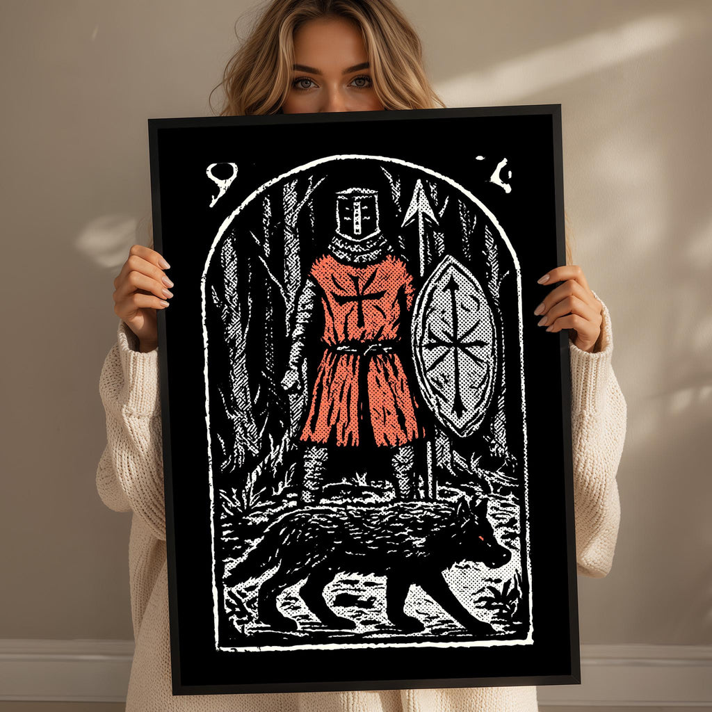 A woman is holding up a framed artwork depicting a knight in red armor and a wolf.