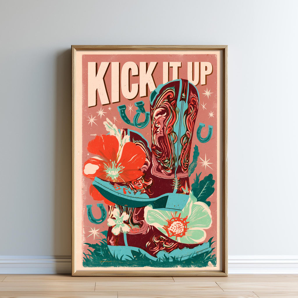 The image is a framed poster with a vibrant, colorful design featuring cowboy boots, flowers, and the text "KICK IT UP" prominently displayed.