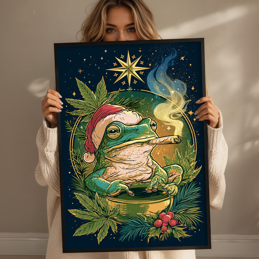 A woman holds up a framed illustration of a frog wearing a Santa hat and smoking a pipe, surrounded by a starry night sky and festive holiday elements.
