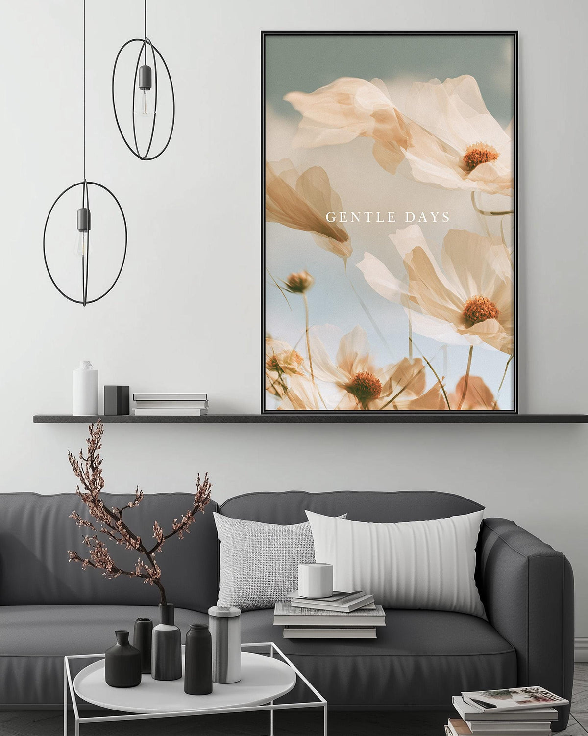 a modern living room with a gray sofa, a coffee table, and a large framed print of flowers on the wall.