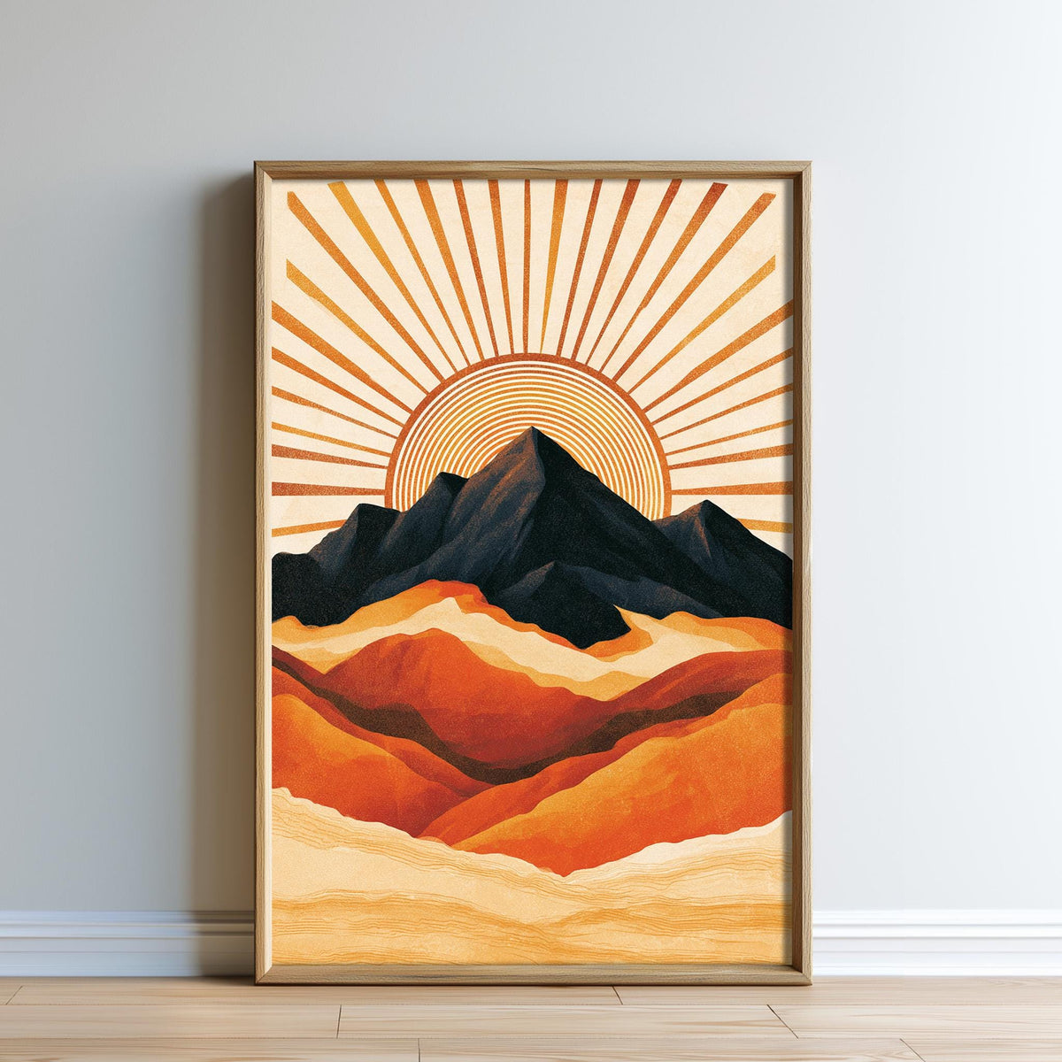 The image is a framed artwork depicting a mountain landscape with a sunburst design in the background.