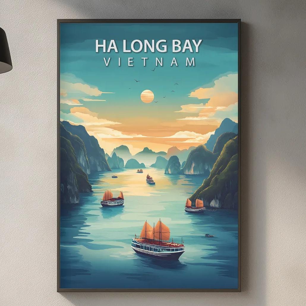 a framed poster of Ha Long Bay in Vietnam hanging on a wall, with a kitchen counter and various kitchen items in the foreground.