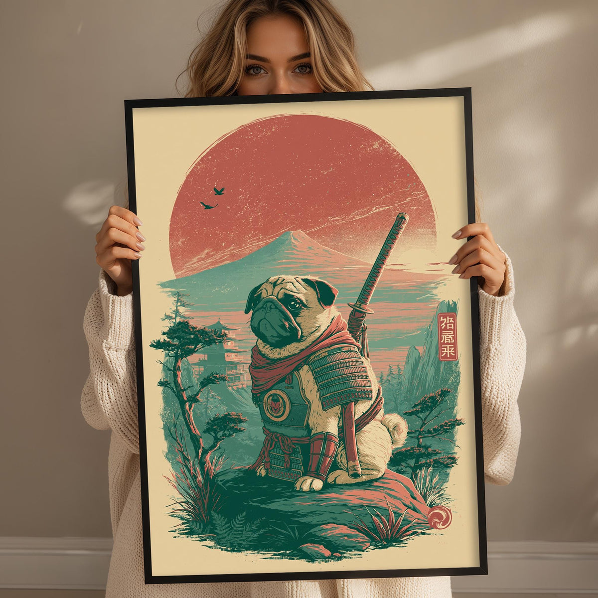 A woman is holding up a framed illustration of a pug dog wearing a suit and holding a sword, set against a colorful landscape with a large sun in the background.