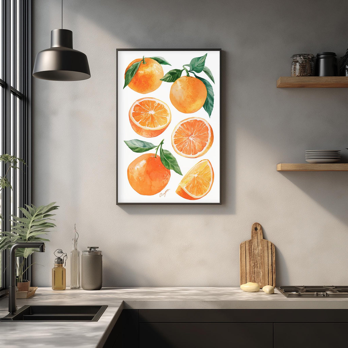 a kitchen counter with a framed print of oranges hanging on the wall above it. The print includes sliced oranges and whole oranges, creating a vibrant and colorful display.